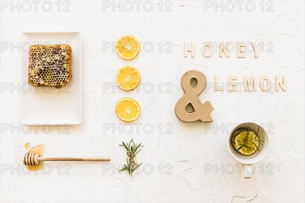 Honey lemon tea with honeycomb lemon slices rosemary