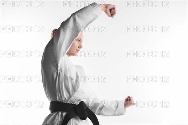 Karate fighter posing side view