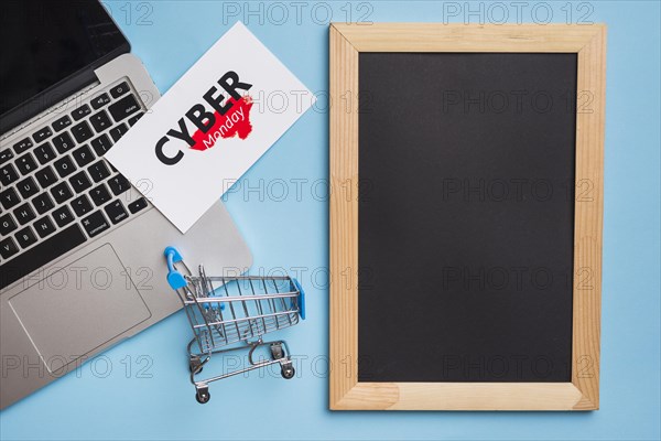 Laptop near tag with cyber monday title frame