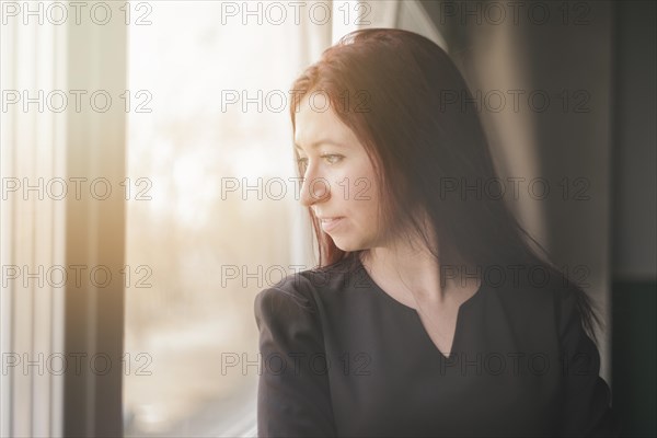 Lawyer looking through window