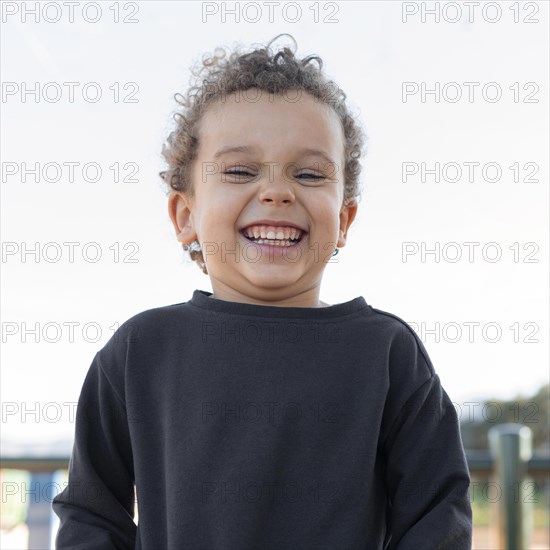 Little boy outdoors smiling 4