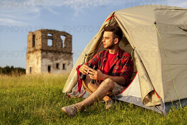 Male camping tent with binocular