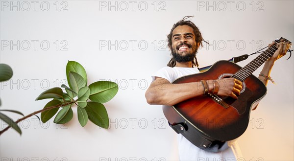 Man playing guitar with copy space