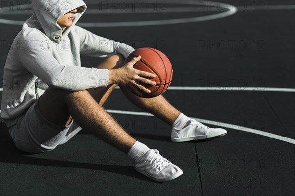 Man sitting court side view