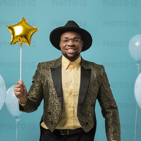 Man suit sunglasses party with balloon