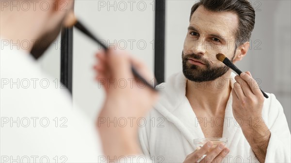 Man using natural ingredients face mask 3