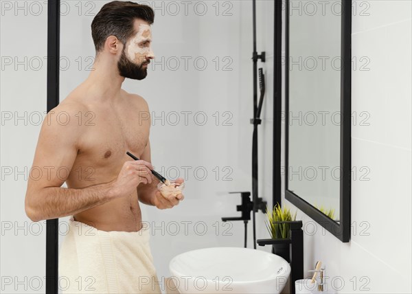 Man using natural ingredients face mask 4