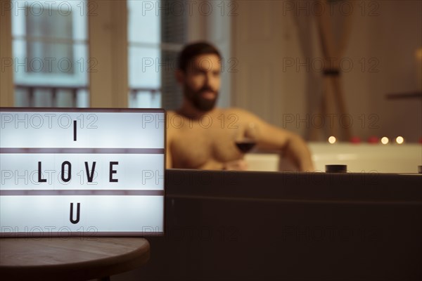 Man with glass drink spa tub i love u title lamp