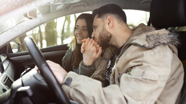 Medium shot couple car