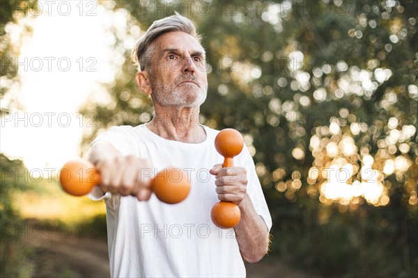 Medium shot man exercising outdoors