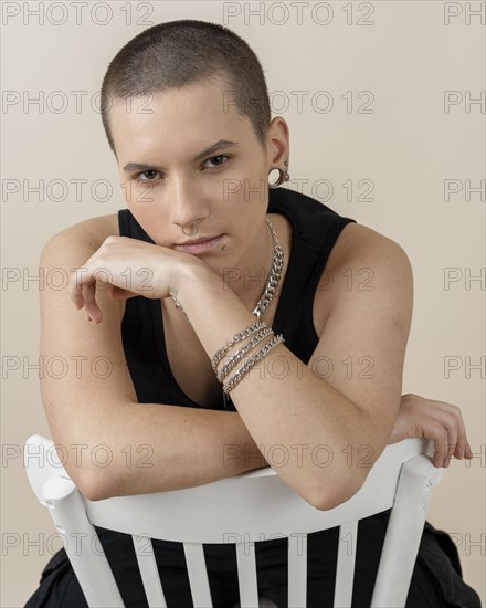 Medium shot woman posing chair