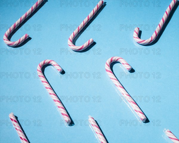 Mint xmas cane candies blue background