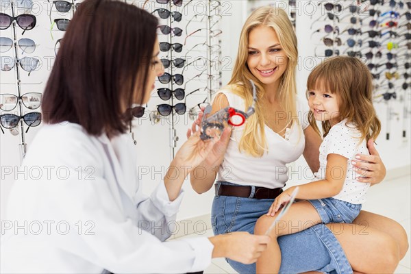 Mother daughter eye examination