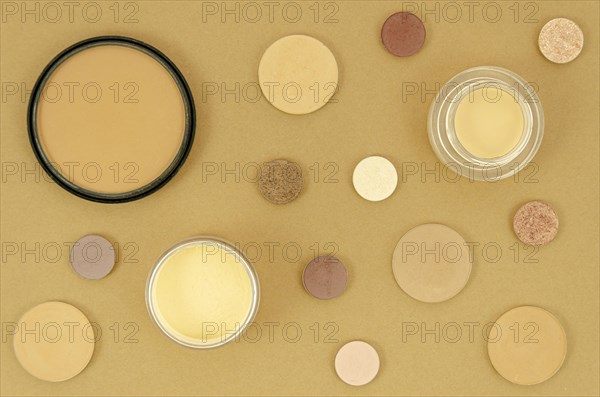Nude make up products beige background