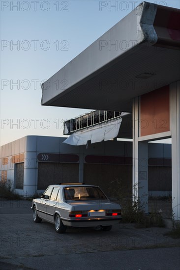 Old parked car with backlights