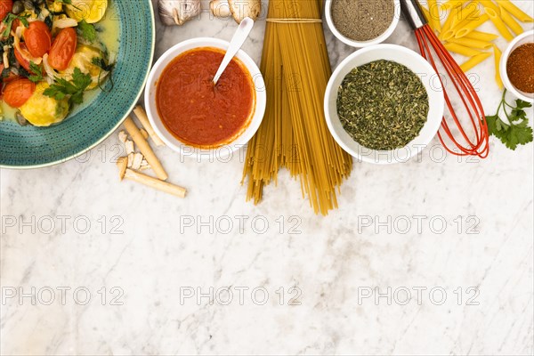 Pasta pasta ingredients marble textured backdrop
