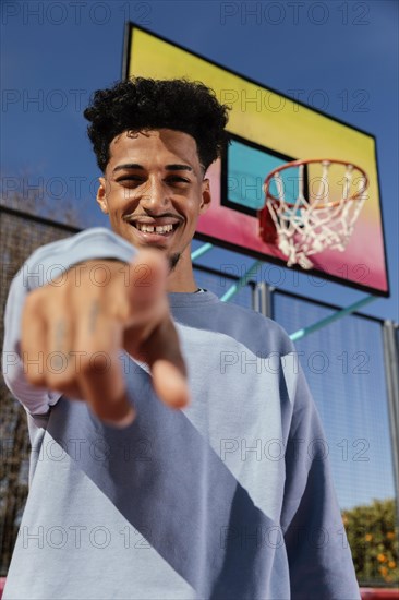 Portrait young man outdoor pointing