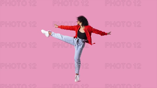 Portrait young woman jumping 2