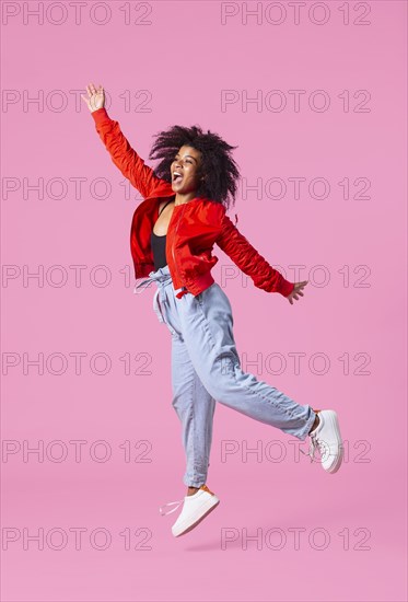 Portrait young woman jumping 3