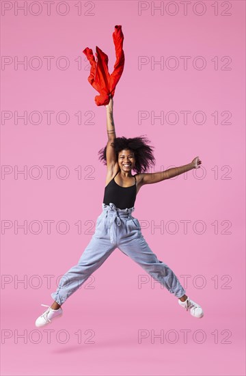 Portrait young woman jumping 4