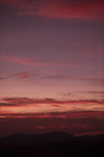 Reddish clouded background sky