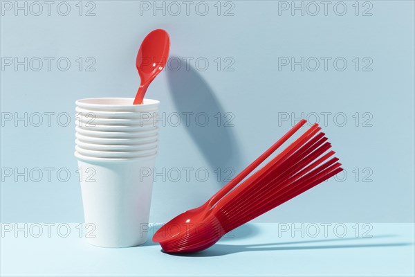 Red small spoons plastic cups