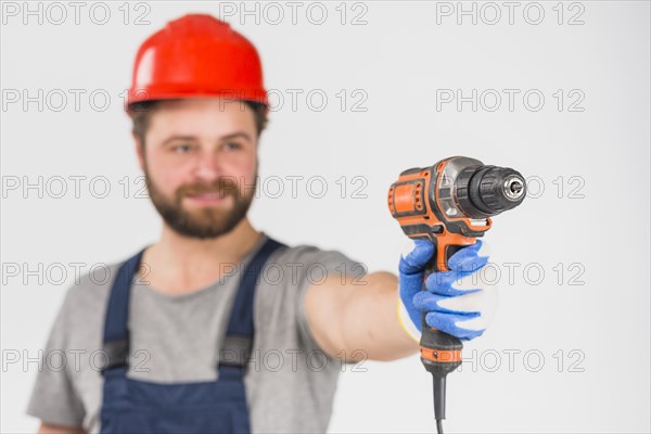 Repairman holding drill hand
