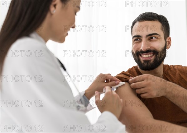 Smiley patient looking female doctor