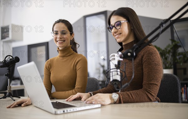 Smiley women broadcasting radio
