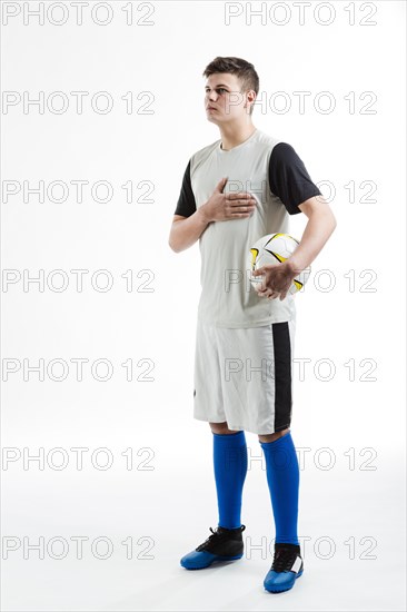 Soccer player with one hand chest