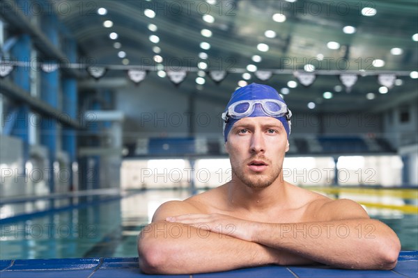 Thinking male swimmer looking grapher