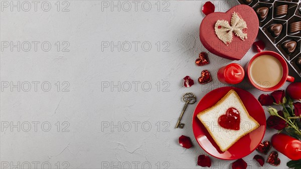 Toast with jam heart shape with coffee cup