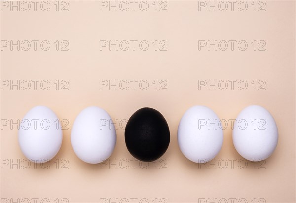 Top view different colored eggs black lives matter movement with copy space