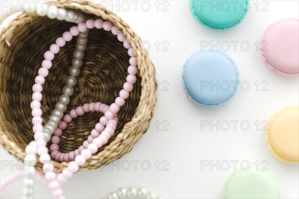 Top view pearl necklace with macarons