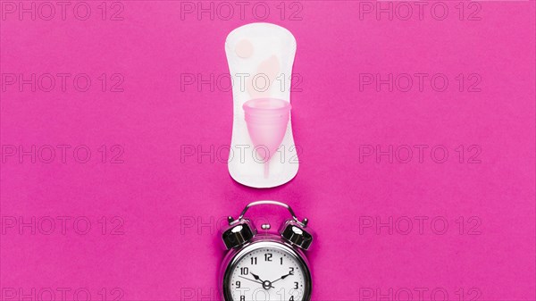 Top view sanitary towel with clock