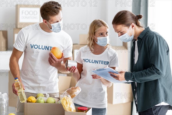 Volunteers helping packing donations world food day