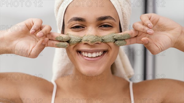 Woman applying homemade treatment her face