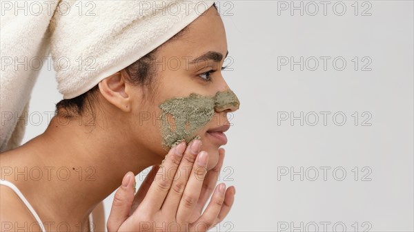 Woman applying homemade treatment her face 2