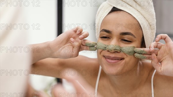 Woman applying homemade treatment her face 3