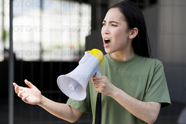 Woman protesting talking megaphone