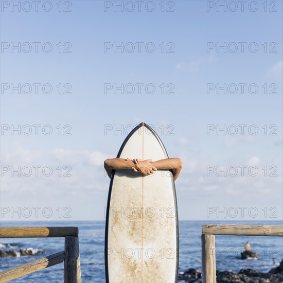 Woman with surfboard beach