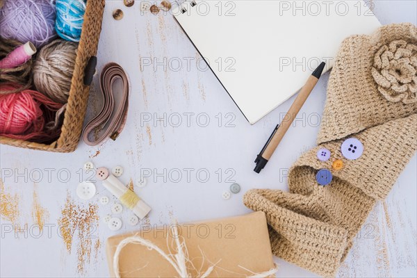 Wool balls basket measuring tape button crochet wooden desk