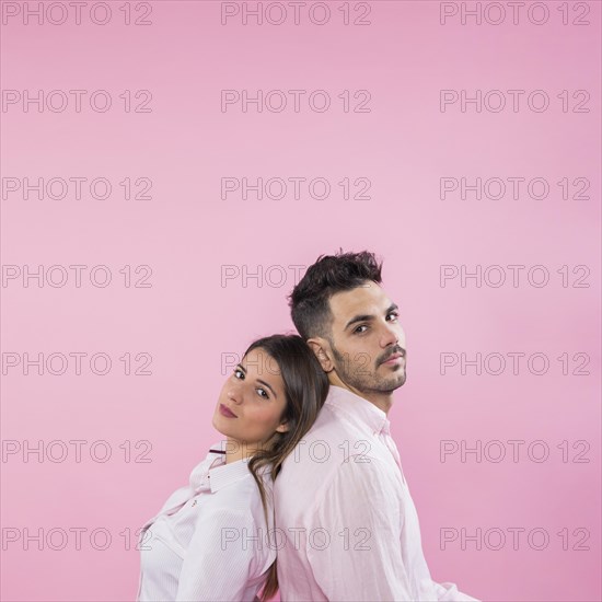 Young couple standing back back