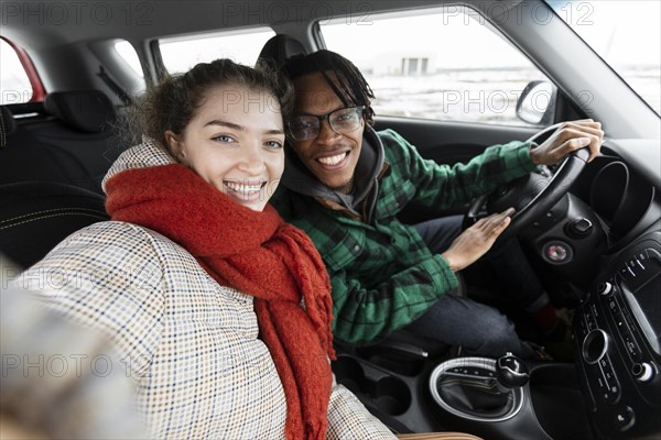 Young couple traveling with car