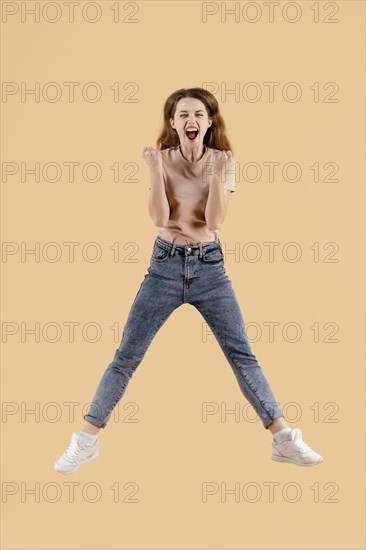 Young female model jumping