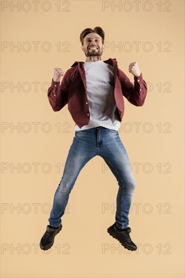 Young handsome man jumping