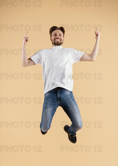 Young handsome man jumping 4