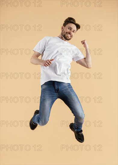 Young handsome man jumping 6