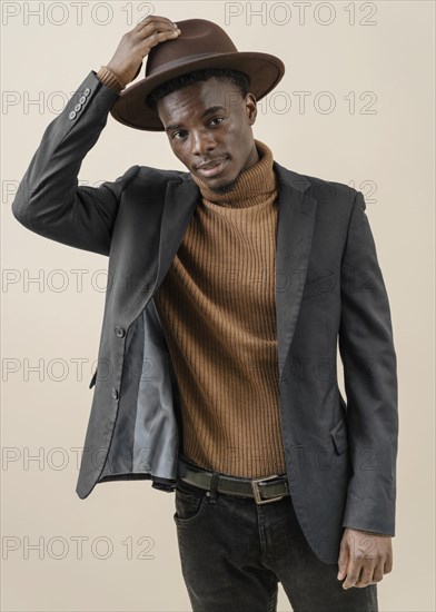 Young handsome man posing with hat 5