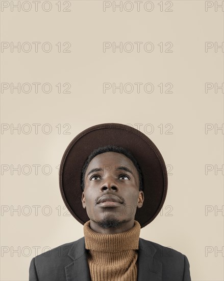 Young handsome man posing with hat 7